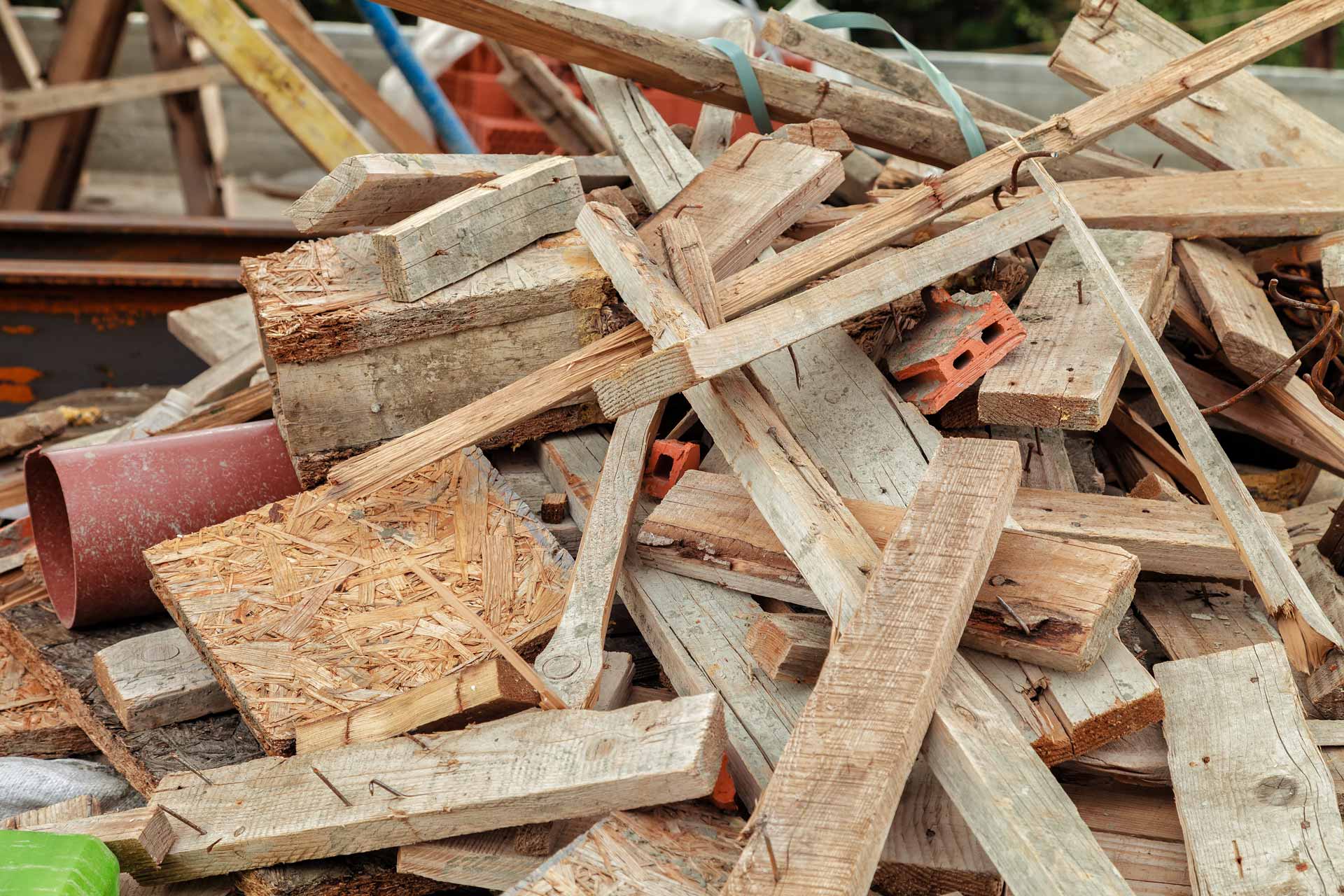 Pile of construction junk like wood, bricks, and scrap metal