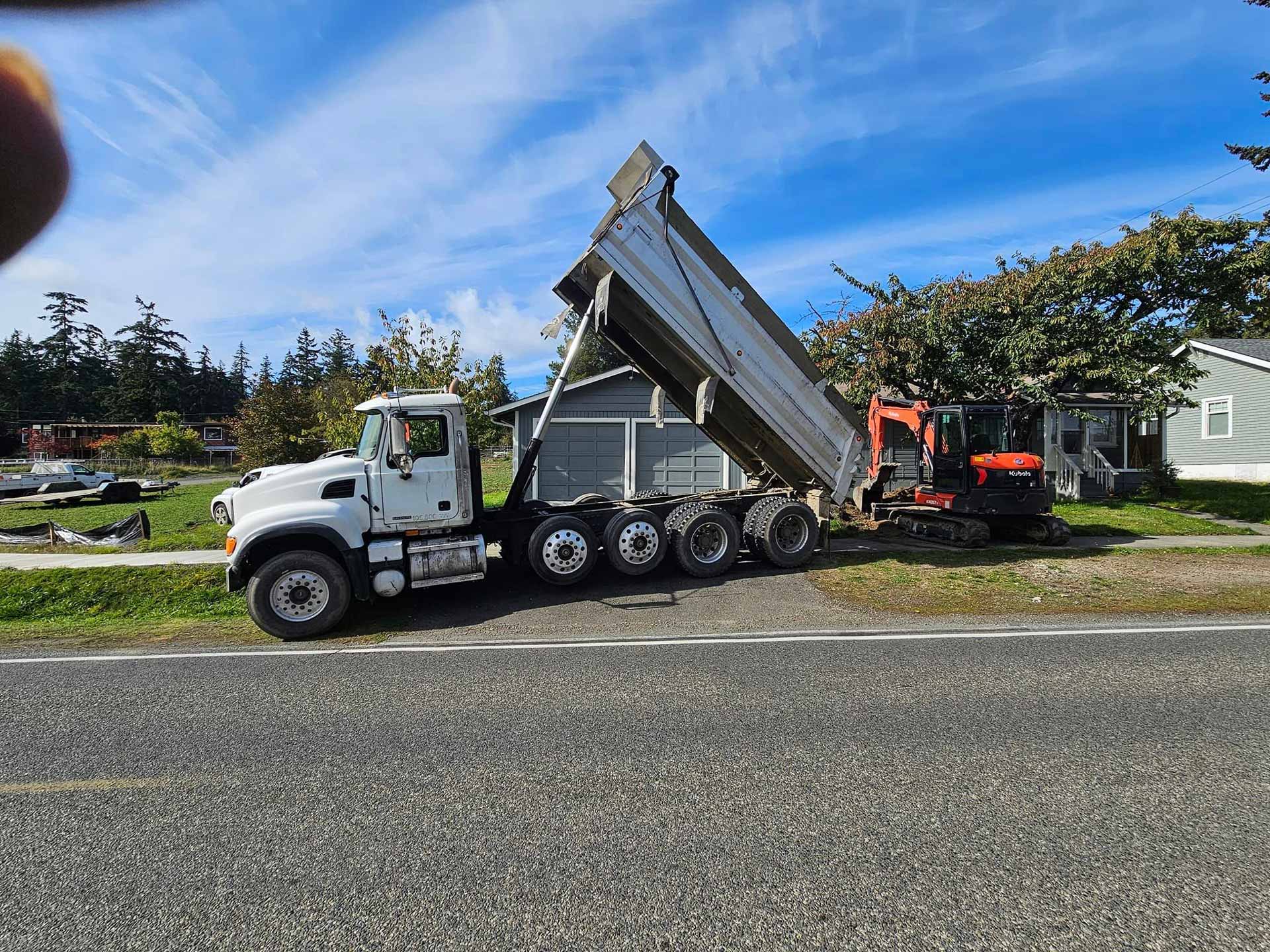 Salish Excavation and Trucking LLC truck parked in driveway